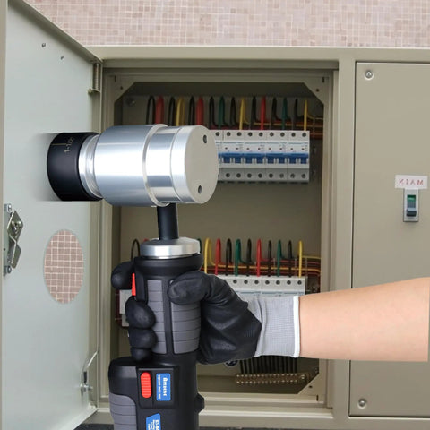 Battery Powered Hydraulic Knockout Punch Kit EZ 8AL being used to punch a hole in a metal electrical enclosure