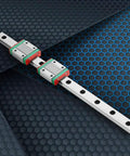Slick Compact Miniature Linear Rail Guide Set 12mm Wide By 250mm Long With Two Slide Blocks on geometric background