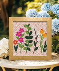 Wildflower Punch Needle Kit Two Pack For Beginners, Embroidery Set with framed floral design on table with hydrangeas