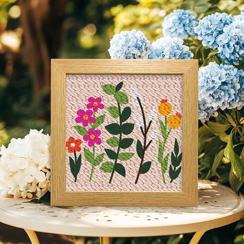 Wildflower Punch Needle Kit Two Pack For Beginners, Embroidery Set with framed floral design on table with hydrangeas