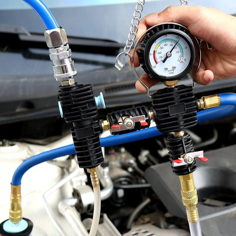 Hand holding gauge on Coolant Vacuum Refill Kit With Universal Hoses For Cars Motorcycles And Trucks Purge And Fill Tool