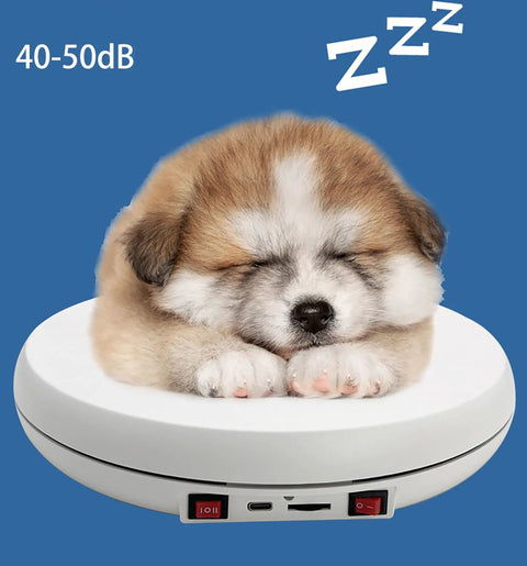 Cute puppy sleeping on a white rotating display stand with USB port, showcasing its 10 inch turntable base.