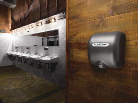 XLERATOR hand dryer on wooden wall in bathroom, suitable for Boss Grade HEPA Filter Retrofit Kit For XLERATOR Hand Dryers.