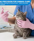 3ml Luer Lock Refilling Syringe Kit 23G 1 Inch Disposable used by vet in blue scrubs with gloves administering liquid to a cat