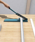 Professional Manual Cable Duct Cutting Tool for Precision PVC Trunking and Din Rail Work, shown cutting a PVC duct.
