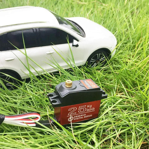 DS3225MG Digital Servo Beefy High Torque Full Metal Gear Waterproof For RC Cars And Crawlers With 270 Degree Control shown on grass