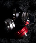 Legit Espresso Coffee Distributor Tamper For 57mm And 57.5mm Portafilters in matte black, silver, and red colors on dark surface.