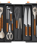 Expandable Kitchen Utensil Organizer for Drawers, Adjustable Cutlery Tray and Spatula Holder, black, with utensils inside