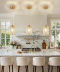 Sleek Gold Brushed Finish 2 Pack Modern Water Ripple Glass Pendant Lights With Adjustable Hanging Cords For Kitchen Island Dining Room Over Sink Super Dope Setup hanging over kitchen island in modern home.