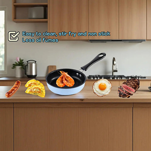 4.7 Inch Mini Nonstick Egg Pan With 5 Layer Coating on kitchen counter with cooked shrimp, ideal for omelets and pancakes