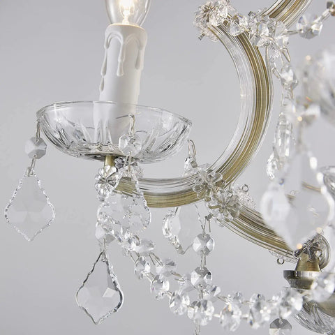 Close-up of Four Light Maria Therese K9 Crystal Chandelier With Antique Brass Finish showing crystal details and arm design.