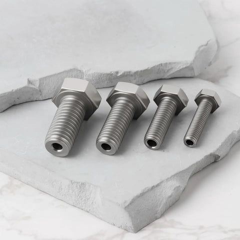 Pro Grade 4 Piece Heavy Duty Stainless Steel Busted Stud Drill Guide Kit M6 M8 M10 M12 showing four stainless bolts on a stone surface.