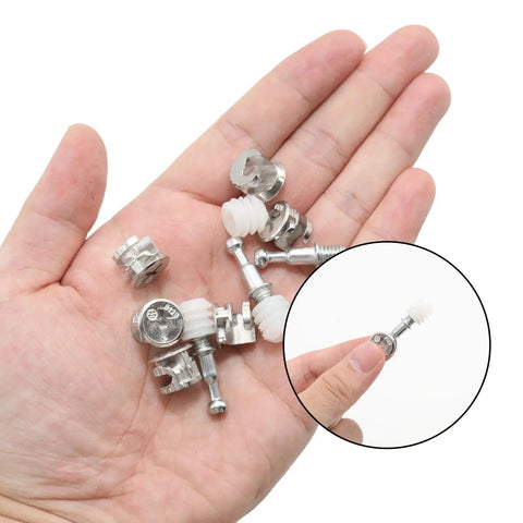 Premium Rock Solid 3 In 1 Cam Lock Connectors with pre inserted dowels in a hand for easy furniture assembly.