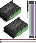 Two TB6600 stepper motor driver boards with green terminal blocks, rainbow ribbon cables, screwdriver, and Dupont wires.