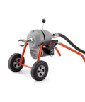 Badass B Frame Sectional Sewer Drain Cleaning Machine With Heavy Duty Cable Carrier displayed on a wheeled frame.