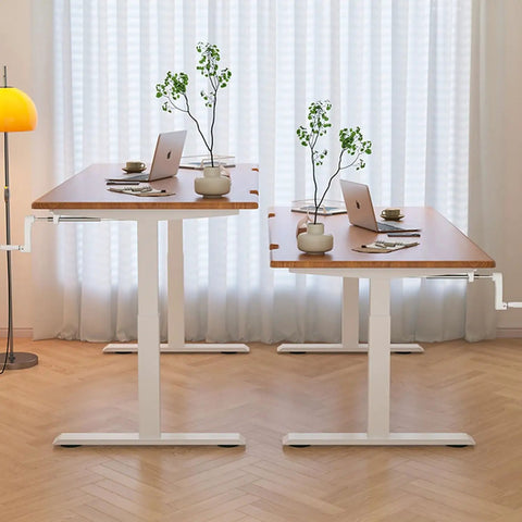 Get Your Posture Locked In With This Cherry Wood Manual Standing Desk And Straight Up Game Changing Crank Lift Mechanism For Home Offices Or Bedrooms Boasting A Foldable Handle And Massive Work Surface, showcasing double desks and plants.