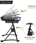 Adjustable Drafting Desk With Stool Multifunction Artist Table For Home Studio Tilting Glass Top Work Surface Diamond Painting Station Two Storage Drawers Heavy Duty Steel Frame Easy Height Adjust, side view showing tilt and height adjustments.