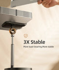 Close-up of Dope Ergonomic Adjustable Desk Phone Stand base showing stability features for home office and gaming setup.