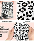 Hands holding cheetah print poly mailers 100 pack 10x13 self seal shipping bags, showcasing water resistance and tear resistance.