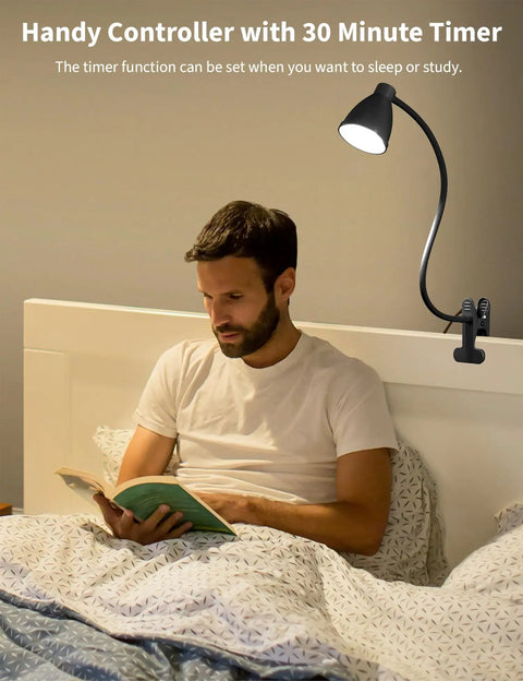 Man reading in bed under Clip On Desk Lamp With Five Color Modes And Stepless Dimming For Reading And Work 10W 38 LED Clamp Light
