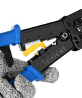 Close-up of All In One RJ45 Crimp Tool Kit With Pass Through Cat5e And Cat6 Connectors, showing crimping tool in gloved hand.