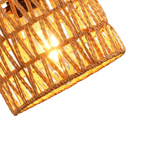 Close-up of Total Vibe Hand Woven Rattan Pendant Light showing woven rattan basket with an illuminated bulb.