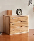 Solid Wood Storage Cabinet With Lockable Drawers for Home and Office, placed on a wooden desk, showing three lockable drawers.
