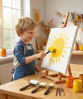 Smiling child using yellow foam roller from 6 Piece Foam Sponge Roller And Brush Set Hella Smooth Kids Painting Tools.