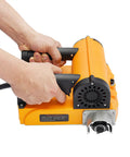 Hands gripping the handle of a Heavy Duty Electric Wall Planer With Adjustable Scraping Depth 0.04 To 0.16 Inches, Handheld Concrete Scraper.