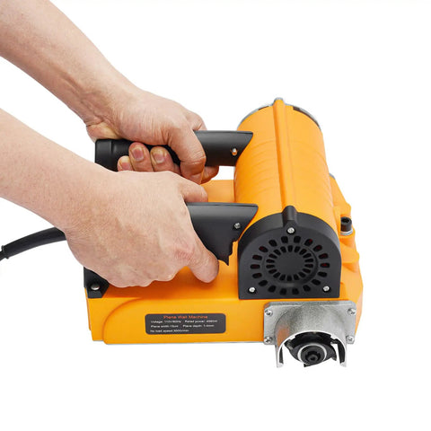 Hands gripping the handle of a Heavy Duty Electric Wall Planer With Adjustable Scraping Depth 0.04 To 0.16 Inches, Handheld Concrete Scraper.