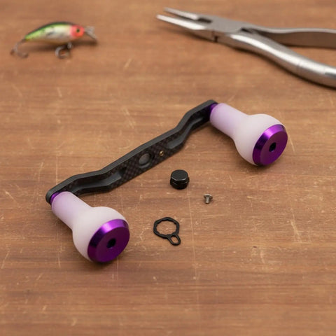 Upgrade Your Gear With This Premium Carbon Fiber Fishing Reel Handle Assembly Featuring Ergonomic TPE Foam Knobs And Non Slip Design For Ultimate Balance And Smooth Cranking Action In Any Angling Adventure Out There Today. carbon fiber reel handle with purple foam knobs and hardware