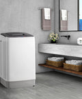 Fully Automatic Portable Washing Machine With Built In Drain Pump And Hands Free Spin Cycle in modern bathroom setting.