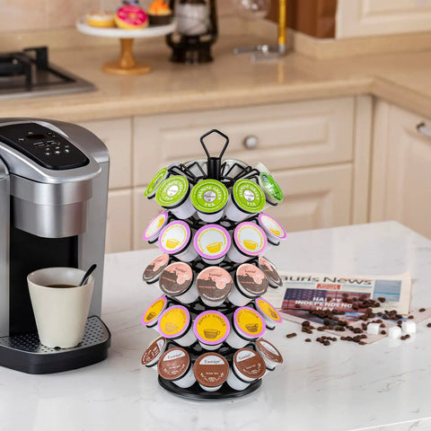 Compact K Cup Storage Carousel That Holds 45 Coffee Pods displayed on kitchen counter near coffee maker.