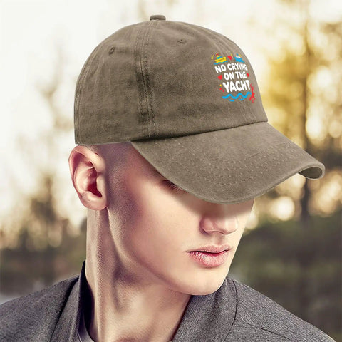 Person wearing brown cap with 'No Crying on the Yacht' text, showcasing the Breathable Lightweight Womens Hat For All Day Outdoor Fun, Ultra Comfortable Cap With SweatWicking Band, Versatile Beach Boat And Sports Sun Shield, EasyCare Headwear For Water Days And Casual Wear.