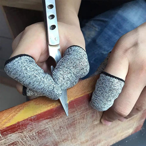 Person wearing cut-resistant finger cots while carving wood, highlighting 12 Piece Finger Cots Set Cut Resistant Protectors, Non Slip HPPE Fabric Finger Covers For Kitchen, Cooking, Work, Sculpture, DIY, Art, And Crafts, Breathable, Reusable, Easy To Clean, Grip Ready.