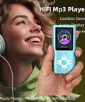Person holding Ultra Slim 1.8 Inch MP3 Player With 16GB Micro SD Card in blue, featuring a color display, alongside headphones.