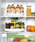Smooth Spinning White Metal Lazy Susan Turntable Two Pack in refrigerator organizing drinks and jars for easy access.
