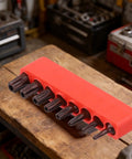 Awesome 8-Piece Torx Security Bit Set With Hardened Steel TS8 To TS40 Sizes For Power Drills Auto And Electronics Repair At 1-Inch Length To Handle Heavy Duty Jobs Without Slipping Or Stripping Threads, red holder on workbench