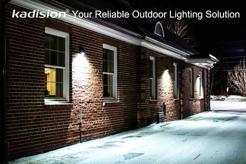 Kickin Bright 30W LED Wall Pack Light With Dusk To Dawn Photocell illuminating brick building exterior at night