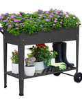 Elevated Outdoor Planter Box On Legs And Wheels, Galvanized Steel Raised Garden Bed with flowers and tools, 38 Inch Long by 16 Inch Wide, Black