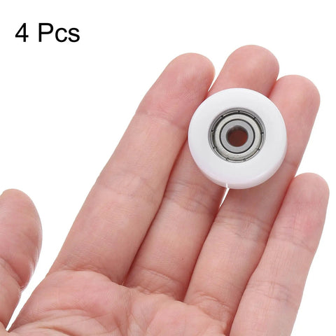 4Pc 625zz Ball Bearing Set, 5X25X9mm Nylon Roller Idler Wheel held in hand, showcasing white nylon and bearing.