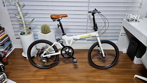 Folding bike with 52T Aluminum Beefy Single Speed Crankset, 170mm arm, and 130mm BCD chainring guard, sand black finish.