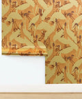 Peach Heron Spring Gold Metallic Wallpaper With Hella Glam Fibrous Texture For Top Shelf Indoor Vibes Professional Paste The Wall Eco Friendly Type I Wall Covering Made In Usa Class A Fire Rated Solid Build roll on wall with glossy finish and floral design.