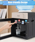 Hot And Cold Water Dispenser With Stainless Steel Liner Compact Desktop Cooler And Heater Three Temperature Settings For Home Office Bedroom Or Studio Use. Visible buttons for hot, cold settings, glass filling with steam.