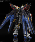 Rear view of Strike Freedom Gundam MGEX Seed Destiny One Hundred Scale Model Kit with extreme metallic finish and golden frame.