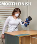 Person using Finish Max HVLP Electric Paint Sprayer for Cabinets, Furniture and Trim with Brass Tip, 3 Spray Patterns