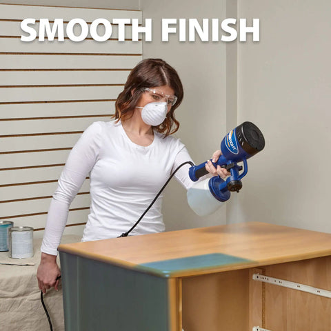 Person using Finish Max HVLP Electric Paint Sprayer for Cabinets, Furniture and Trim with Brass Tip, 3 Spray Patterns
