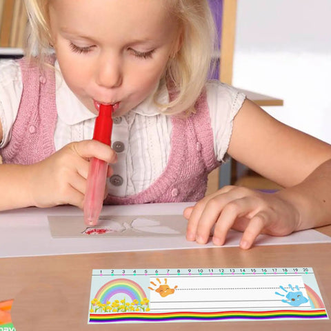 Child using a red blower pen next to 40 Pack Self Adhesive Nameplate Pockets for Desks, Clear 18.9 x 4.7 Inch Outer Pocket Size