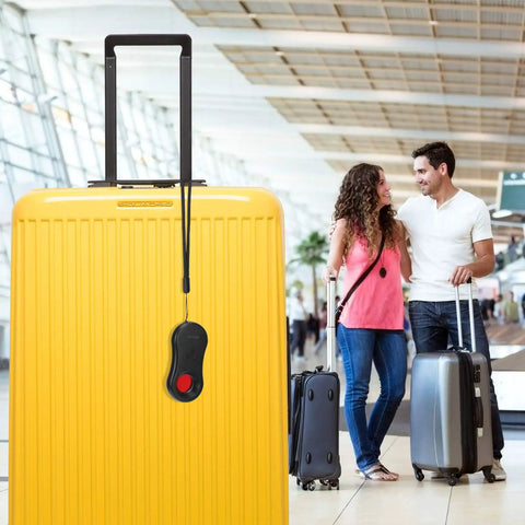 Anti Spy Camera Detector With Infrared Viewfinder on yellow suitcase with travelers in airport, Pocket Sized Hidden Camera Finder For Airbnb Hotels And Bathrooms.