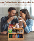 Slick Two Tier Coffee Bar Organizer With Clear Acrylic Window Top And Built In Drawer, Compact Countertop Storage Box For Coffee Pods And Mugs, Dope Kitchen Counter Setup For Your Morning Brew Routine on a wooden table.